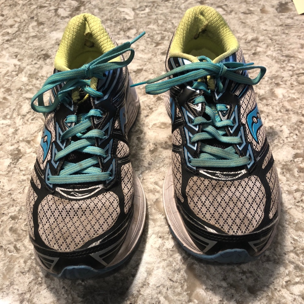 Pair of worn in oasis sneakers.